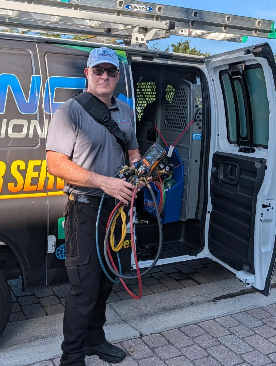 SBS-NC technician with diagnostic gauges at the service van in Stuart, FL